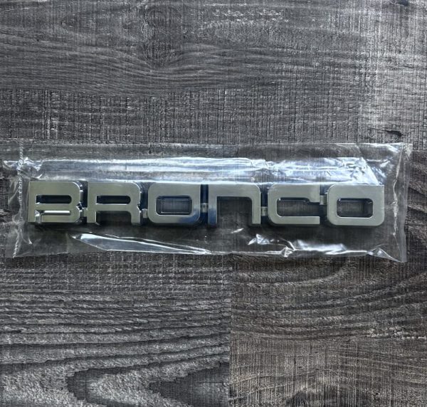 Genuine OEM NOS 1987 1988 1989 1990 1991 FORD BRONCO FRONT FENDER EMBLEM IN CHROME E7TZ16720